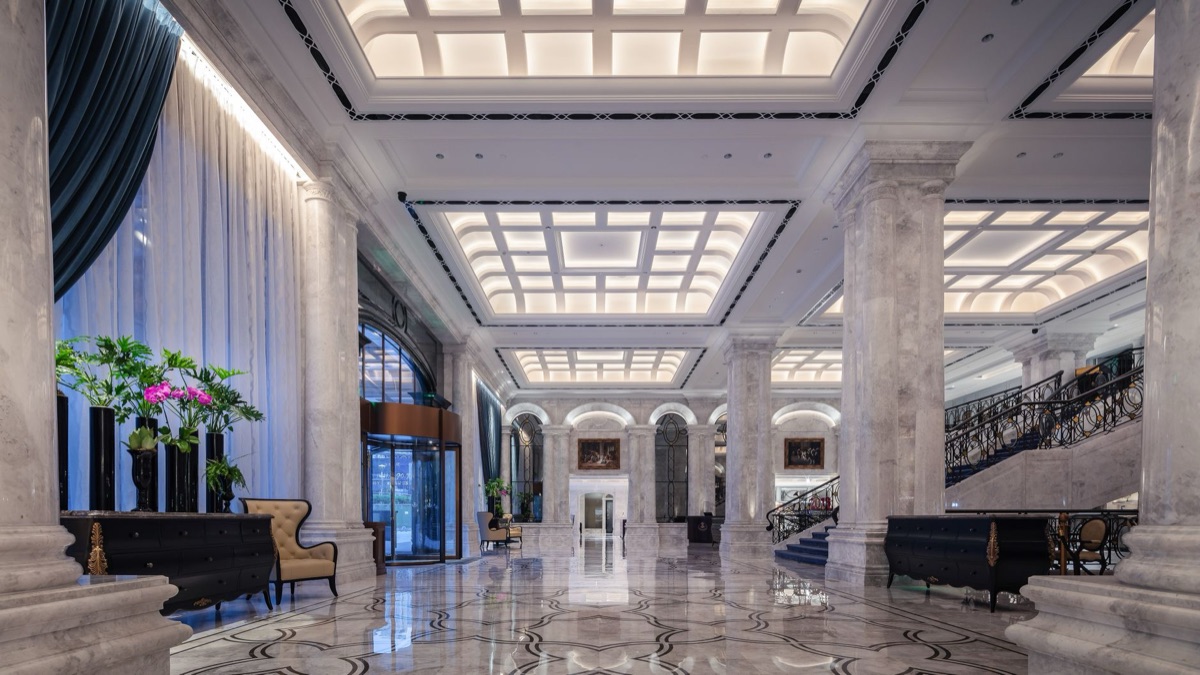 Resort lobby with chandeliers and marble floors