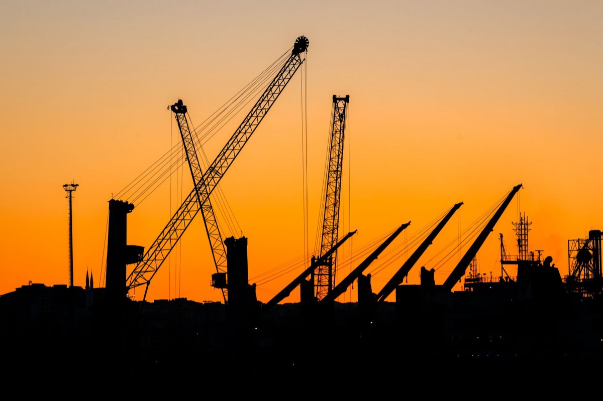 Construction site with cranes and scaffolding