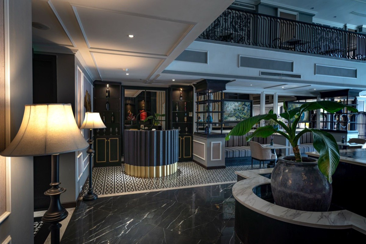 Resort hotel lobby with marble floors and glass key display