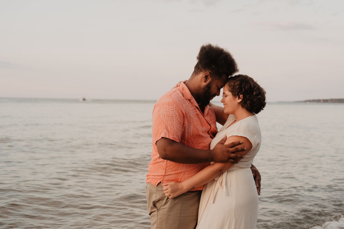 Couple on private beach at sunset