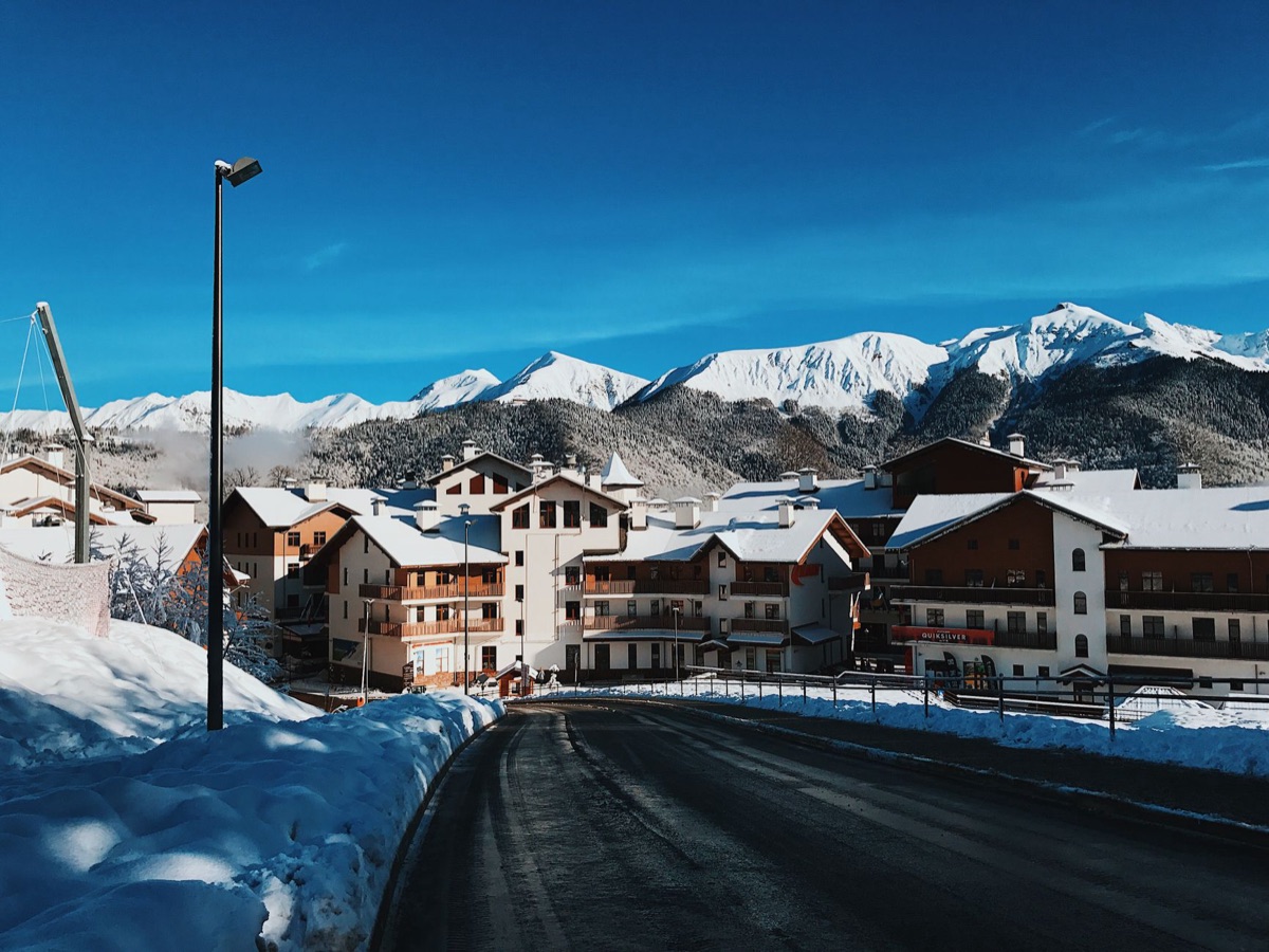 Snowy mountain with luxury resort in the foreground